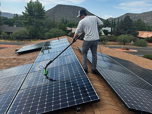 Solar panel cleaning with a soft brush and pure water